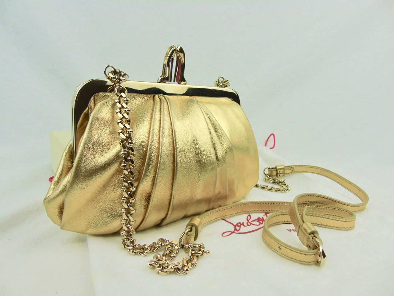 CHRISTIAN LOUBOUTIN Gold Mini Clutch bag with crossbody chain T