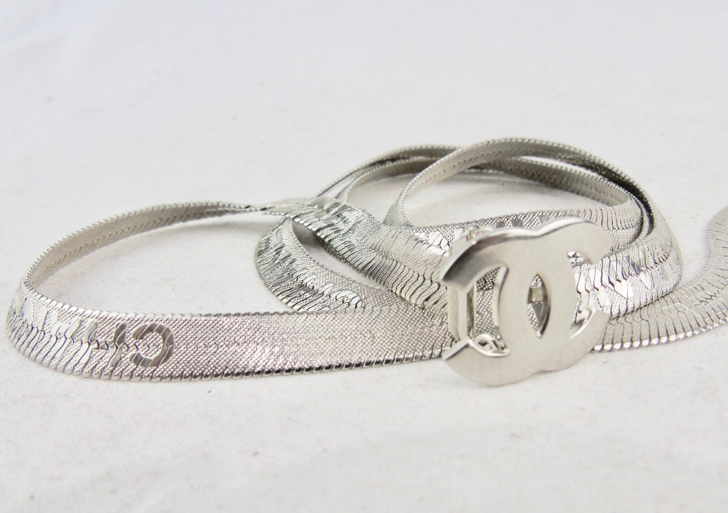 CHANEL stunning silver multi logo metal belt with cc clasp